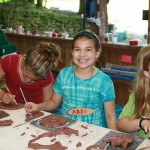 Kids building pottery at summer camp