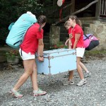 Girls Moving Trunks into Summer Camp