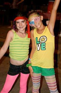 Camp girls dancing to 1980s music