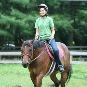 Girl equestrian camp horse riding