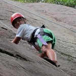 Summer camp girls rock climbing