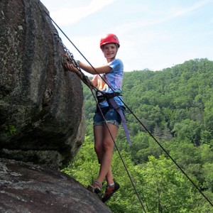 Rock climbing camps girl at the top