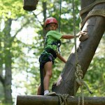 girl summer camp ropes course climber