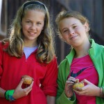girls eating muffins at summer camp