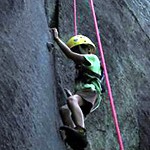 Camp kid rock climbing