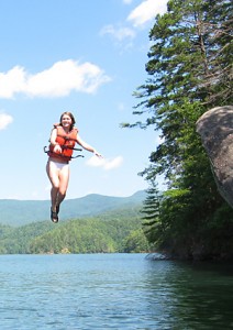 Girl Jumps into lake from Rock