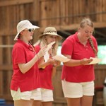 Summer camp staff members singing a song
