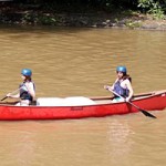 Girl Camp lake canoe activity