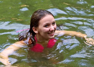 camper demonstrating her swimming ability