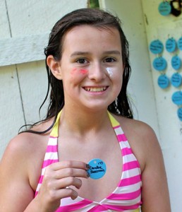 Girls proud of her swim demo tag